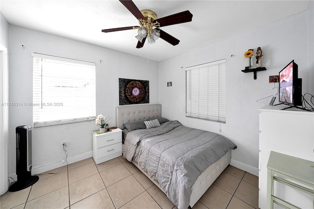 bedroom featuring light tile patterned floors and ceiling fan