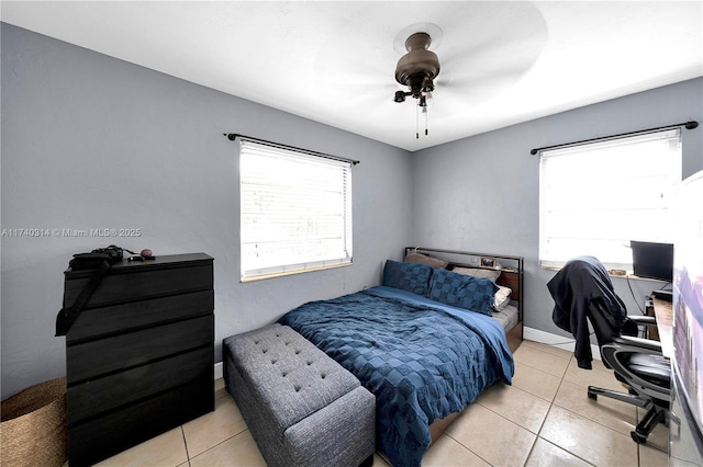 tiled bedroom with ceiling fan