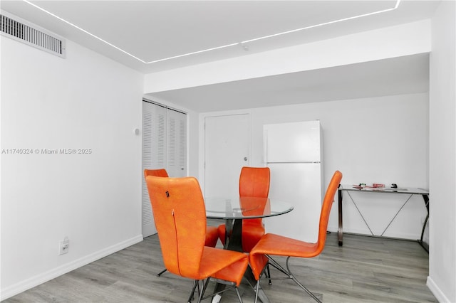 dining area featuring hardwood / wood-style flooring