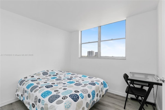 bedroom with wood-type flooring