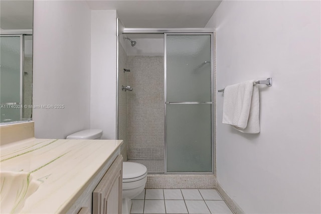 bathroom with vanity, an enclosed shower, tile patterned floors, and toilet