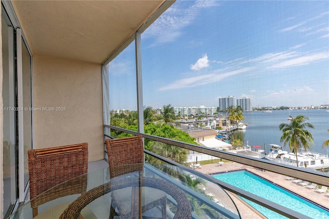 balcony featuring a water view