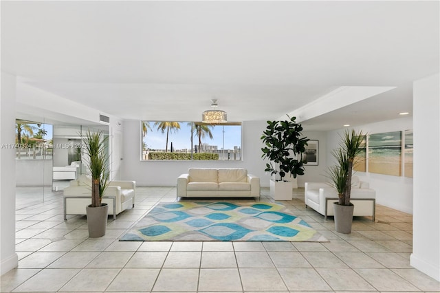 unfurnished living room featuring light tile patterned floors