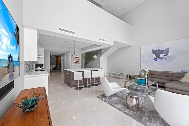 living room featuring a high ceiling