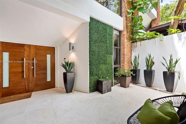 exterior space with lofted ceiling and plenty of natural light