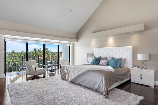 bedroom with access to outside, high vaulted ceiling, and dark hardwood / wood-style floors