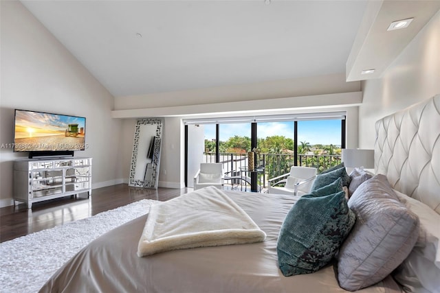 bedroom featuring dark hardwood / wood-style floors, access to outside, and high vaulted ceiling