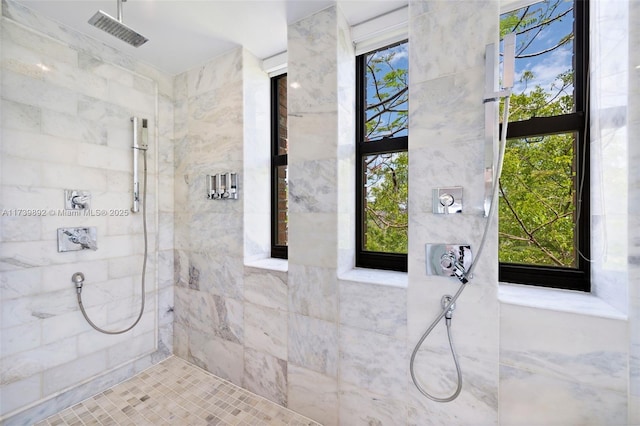 bathroom with tiled shower