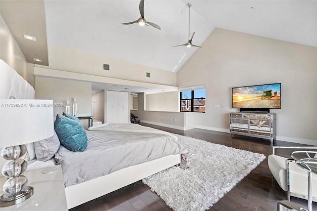 bedroom featuring ceiling fan, dark hardwood / wood-style floors, and high vaulted ceiling