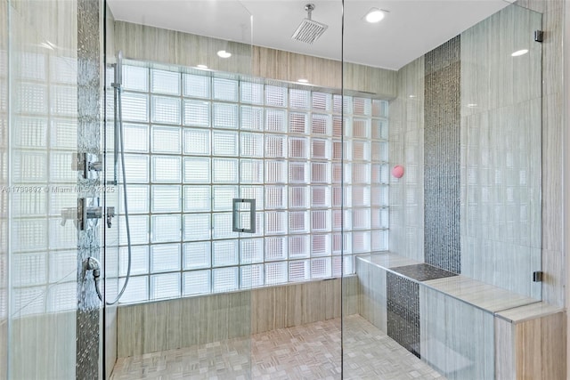 bathroom with tiled shower