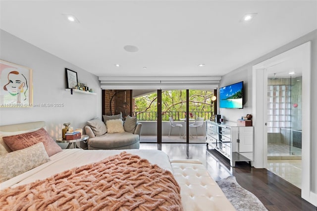 bedroom featuring dark wood-type flooring and access to exterior