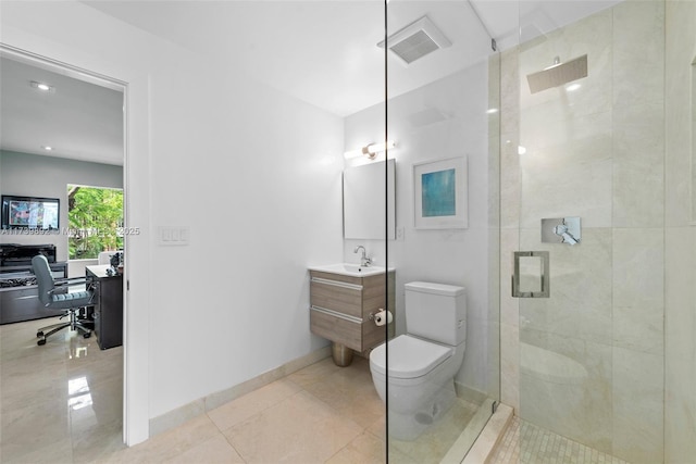 bathroom featuring vanity, tile patterned flooring, a shower with shower door, and toilet