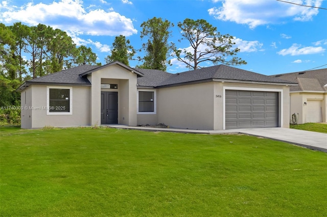 view of front of home featuring a garage and a front yard