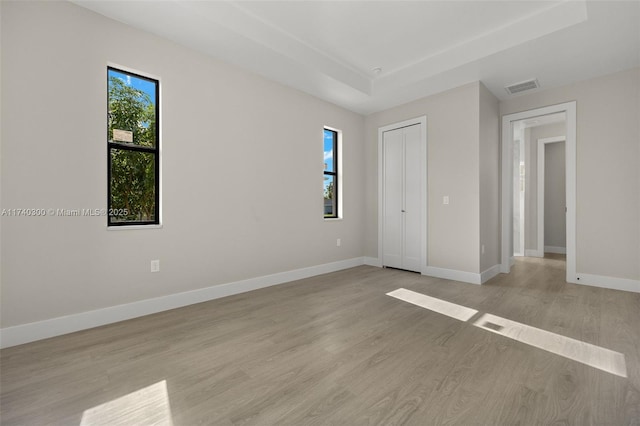 empty room with light hardwood / wood-style floors