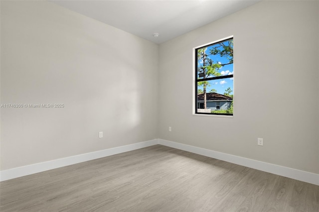 unfurnished room featuring light wood-type flooring