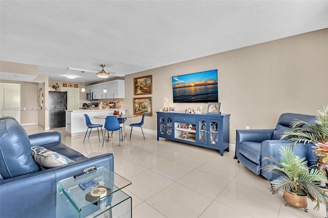 tiled living room with a textured ceiling