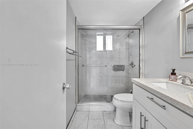 bathroom featuring vanity, an enclosed shower, and toilet