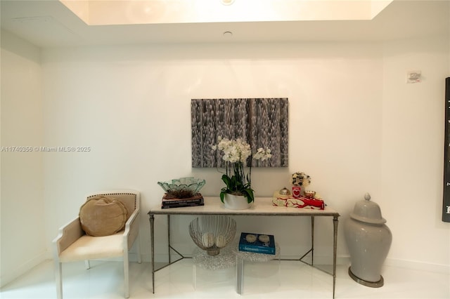 sitting room featuring baseboards