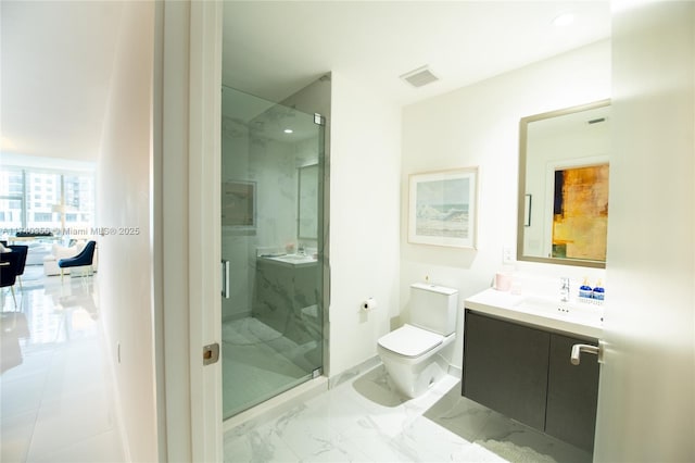 full bath featuring a marble finish shower, toilet, marble finish floor, and vanity