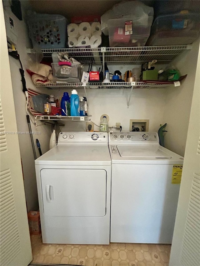 washroom featuring washer and clothes dryer