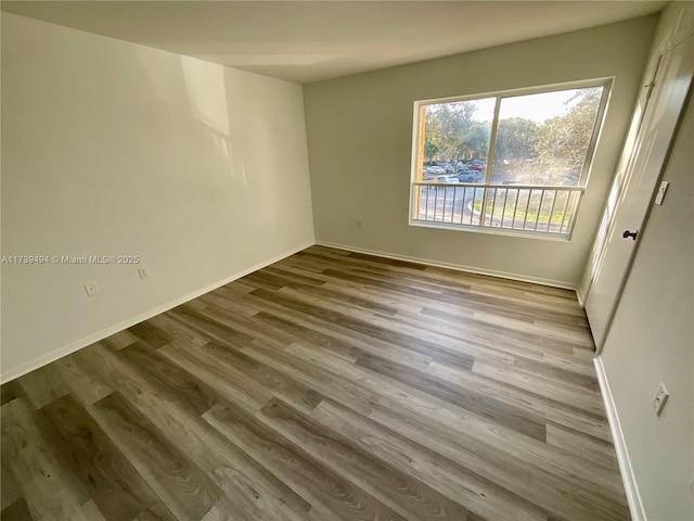 spare room with light hardwood / wood-style floors