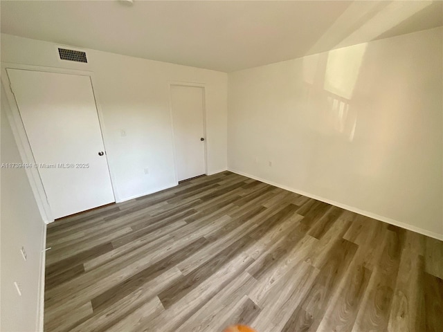 interior space featuring hardwood / wood-style flooring and a closet