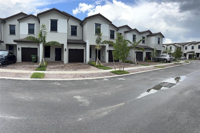 257 SW 159th Ct Unit 0, Pembroke Pines, FL 33027 - townhome / multi-family property with a garage, a residential view, driveway, and stucco siding