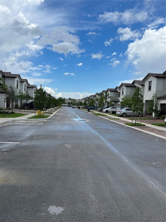 257 SW 159th Ct Unit 0, Pembroke Pines, FL 33027 - view of asphalt road featuring a residential view, sidewalks, and curbs