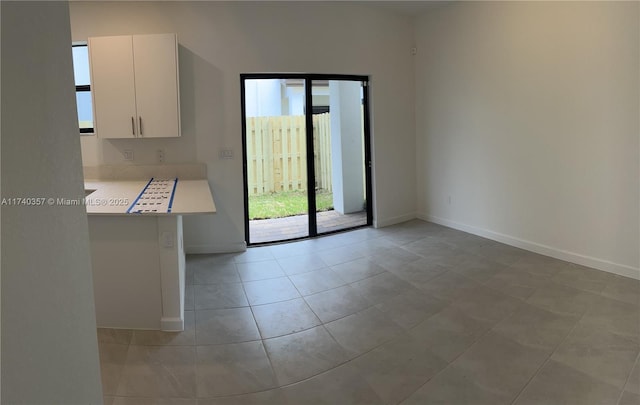 empty room with light tile patterned floors