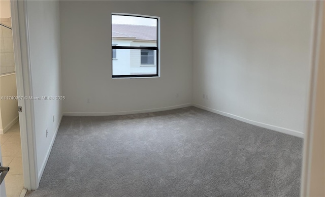 unfurnished room featuring carpet floors