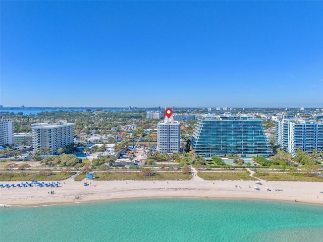 aerial view featuring a view of the beach and a water view