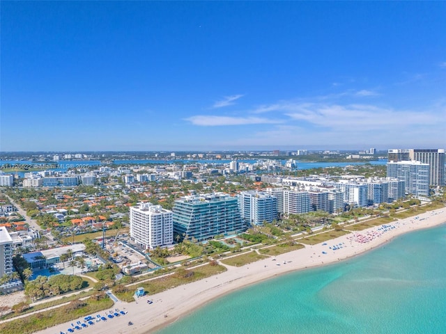 bird's eye view featuring a beach view and a water view