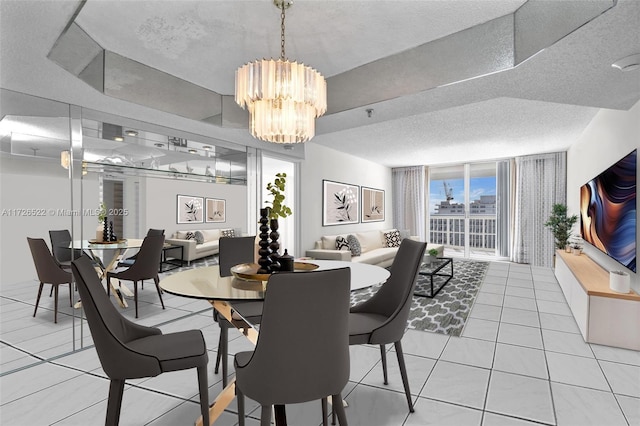 tiled dining room with an inviting chandelier and a textured ceiling