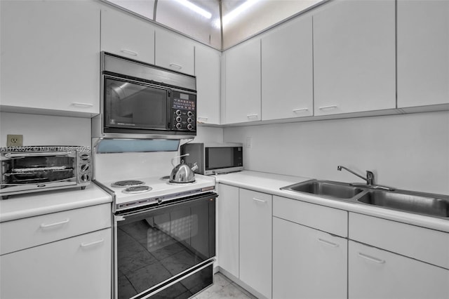 kitchen featuring white cabinets, sink, and range with electric stovetop