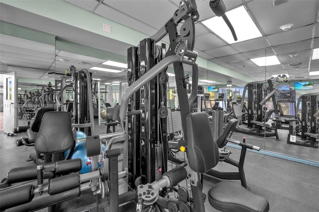 gym featuring a drop ceiling