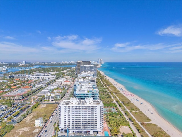 aerial view featuring a view of the beach and a water view