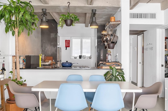 kitchen with pendant lighting and stainless steel fridge