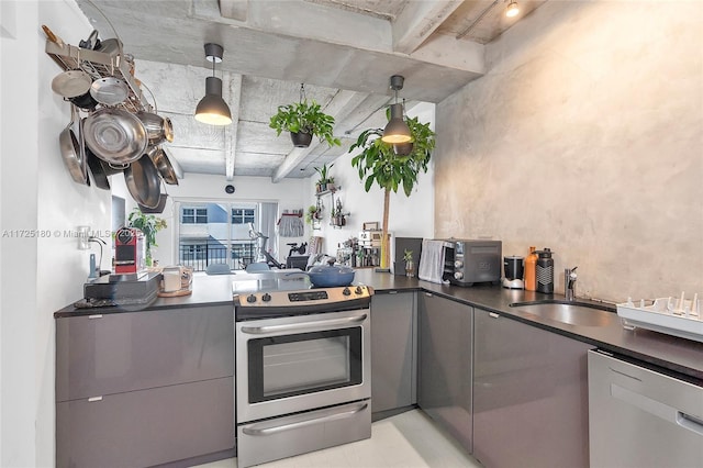 kitchen featuring sink, appliances with stainless steel finishes, gray cabinetry, hanging light fixtures, and beam ceiling