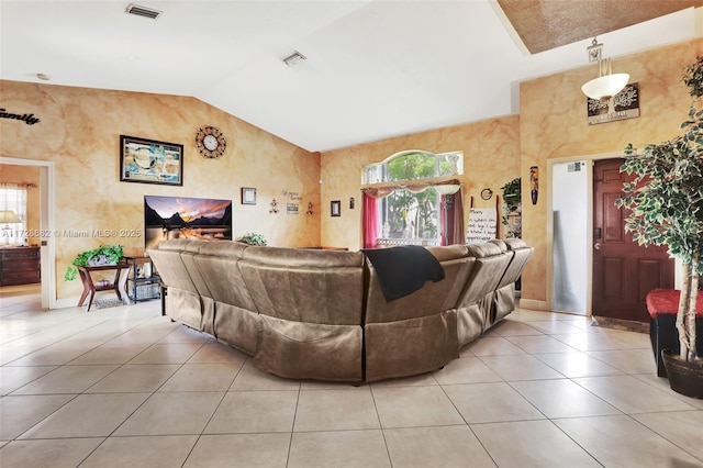 living room featuring light tile patterned flooring and lofted ceiling