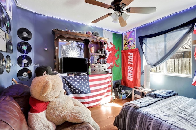 bedroom featuring wood-type flooring and ceiling fan