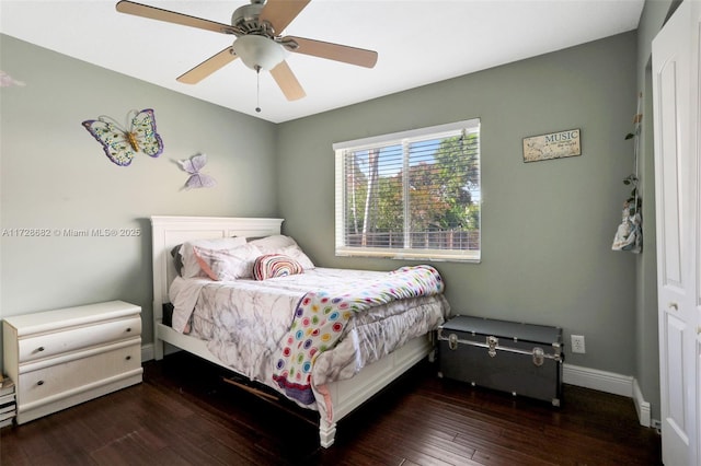 bedroom featuring dark hardwood / wood-style flooring and ceiling fan