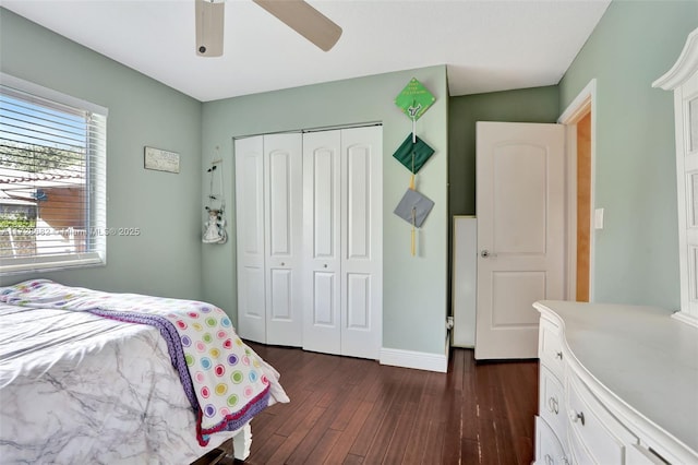 bedroom with ceiling fan, dark hardwood / wood-style flooring, and a closet