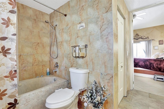 bathroom with tile patterned flooring, tile walls, shower / bath combination with curtain, and toilet