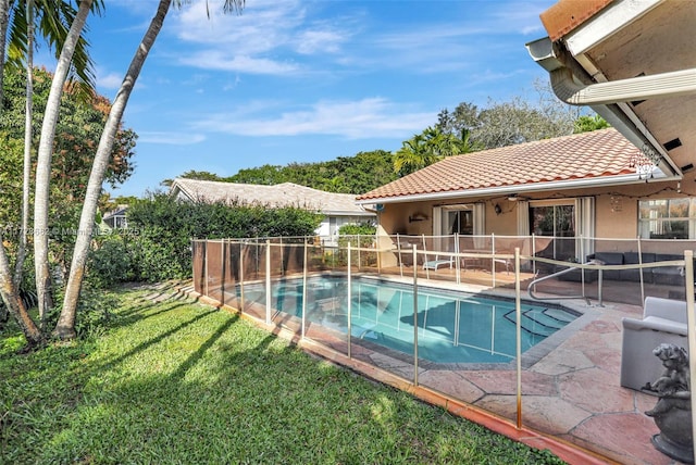 view of pool featuring a yard, a patio, and ceiling fan