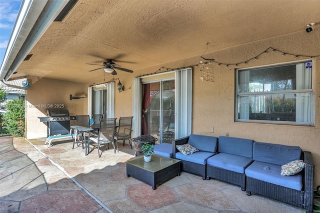 view of patio / terrace featuring ceiling fan, an outdoor living space, and area for grilling