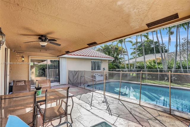 view of pool with a patio area and ceiling fan