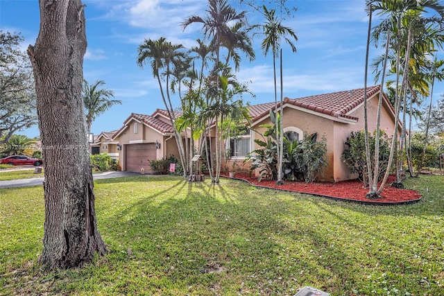 view of front of property featuring a garage and a front yard