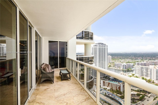 balcony featuring a water view