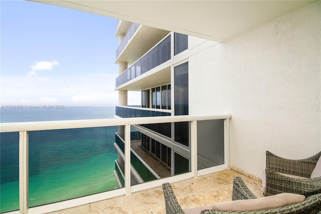 balcony featuring a water view