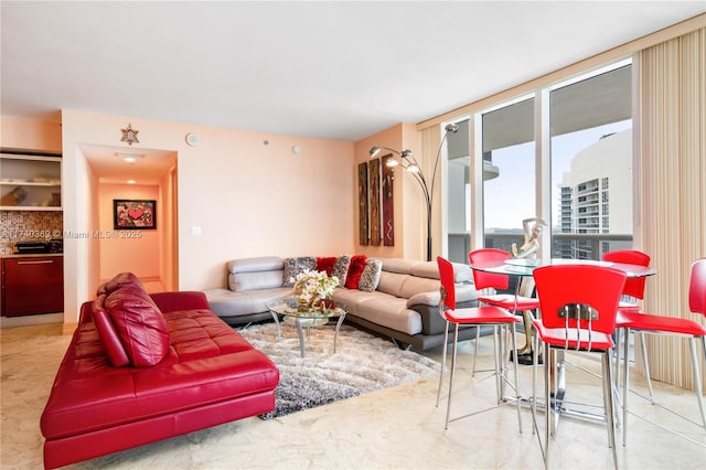 living room featuring a wall of windows